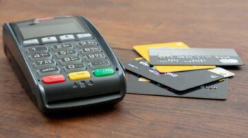 payment machine pos terminal and credit cards on w 7ZAB9C2 scaled 1